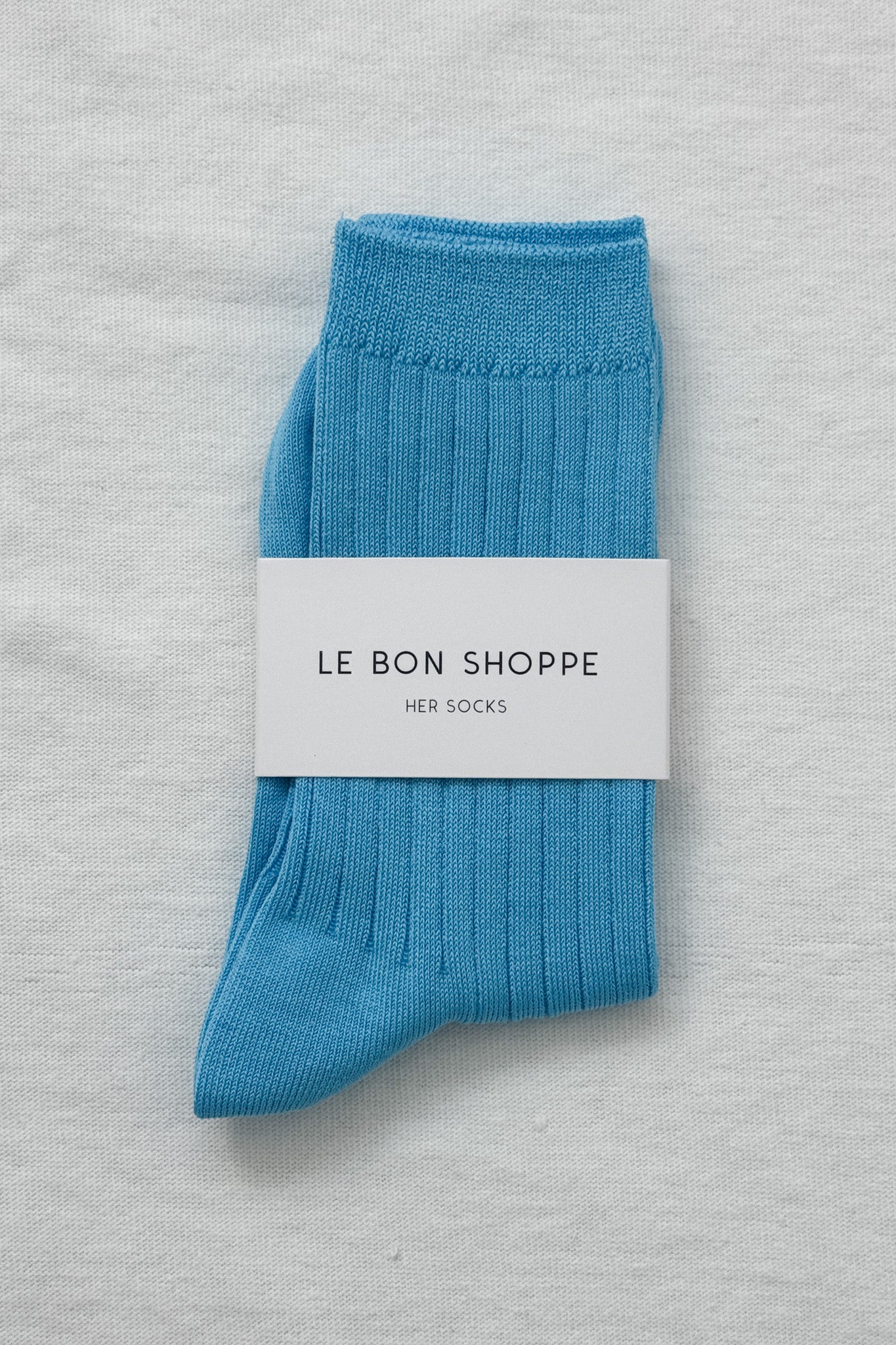 Her Socks in Blue Water