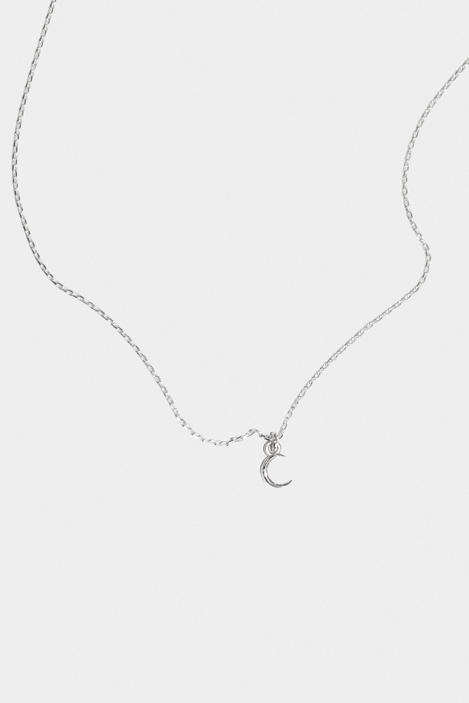 Itty Bitty Crescent Moon Pendant Necklace in Sterling Silver